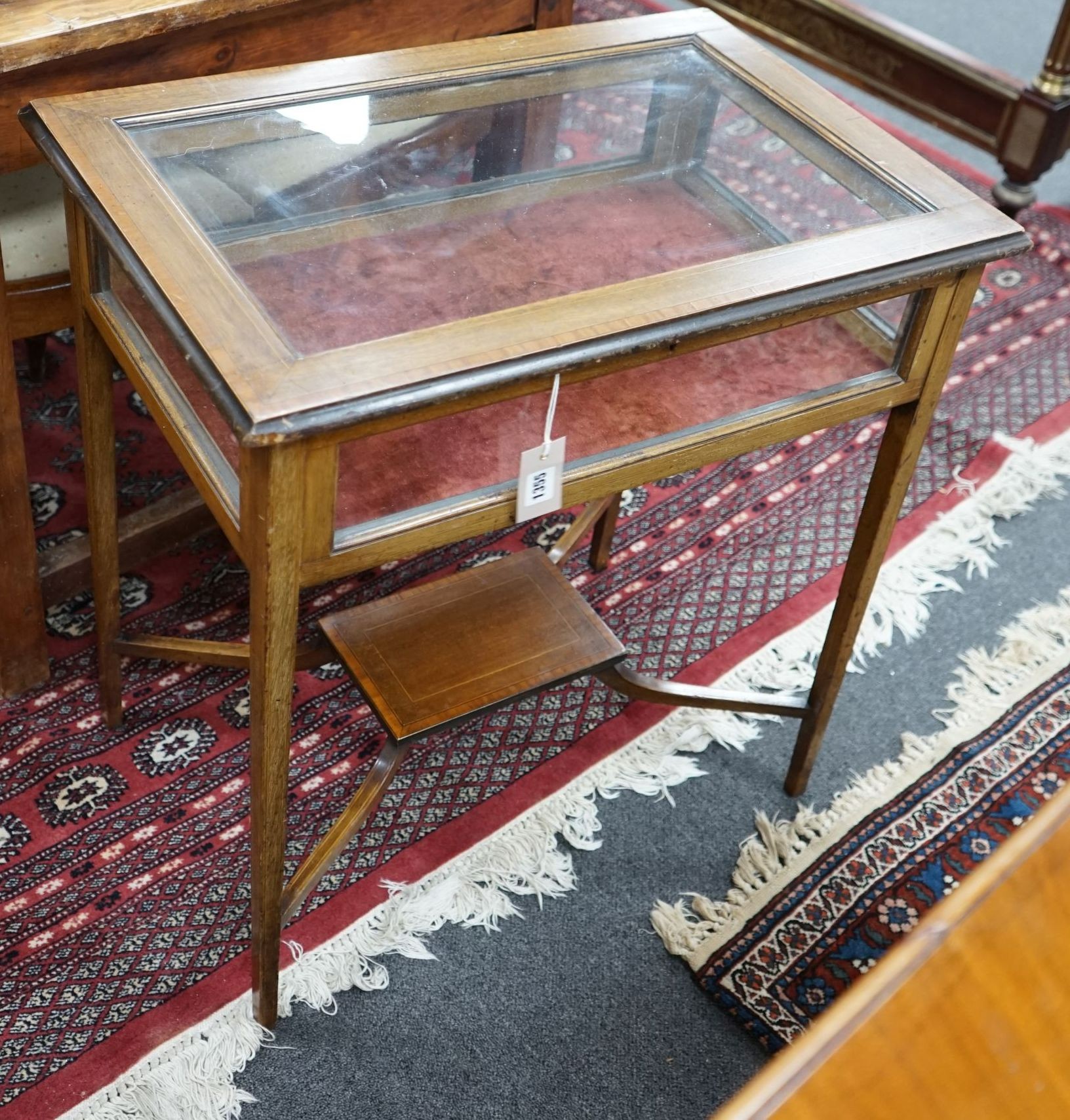 An Edwardian satinwood banded mahogany bijouterie table with under tier, width 65cm, depth 44cm, height 69cm